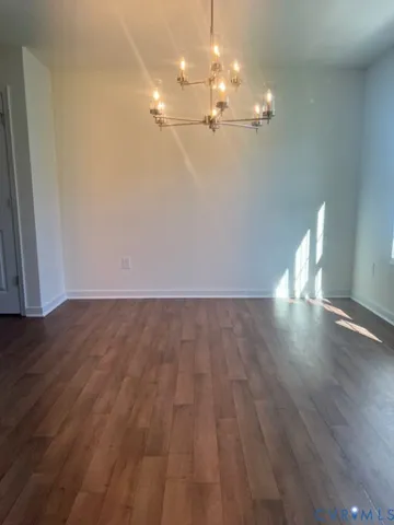 a kitchen with kitchen island granite countertop a sink a stove and a refrigerator