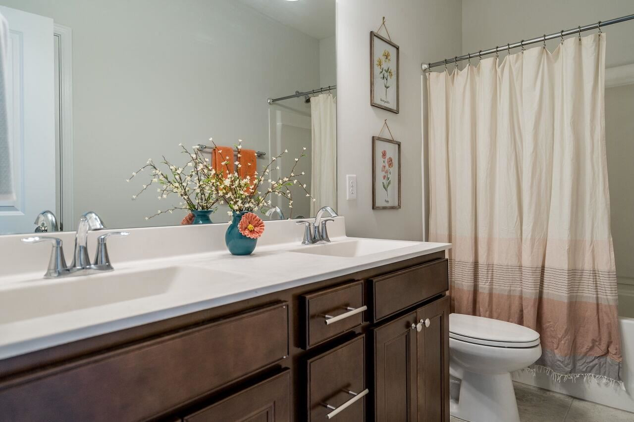 5220 Beckom Street Raleigh, NC 27616 - Photo 22 of 30 Three bathrooms are found in this home and this one has a tub/shower combination. Bathroom