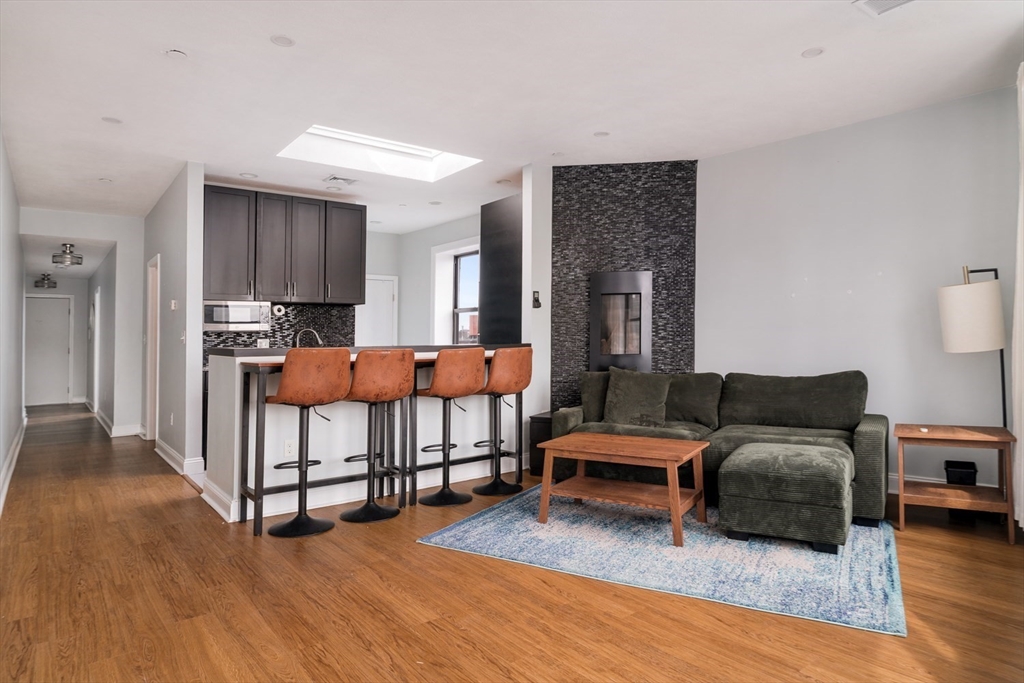 188 North Street, Unit 64 Boston, MA 02113 - Photo 19 of 27 a bedroom with furniture and wooden floor