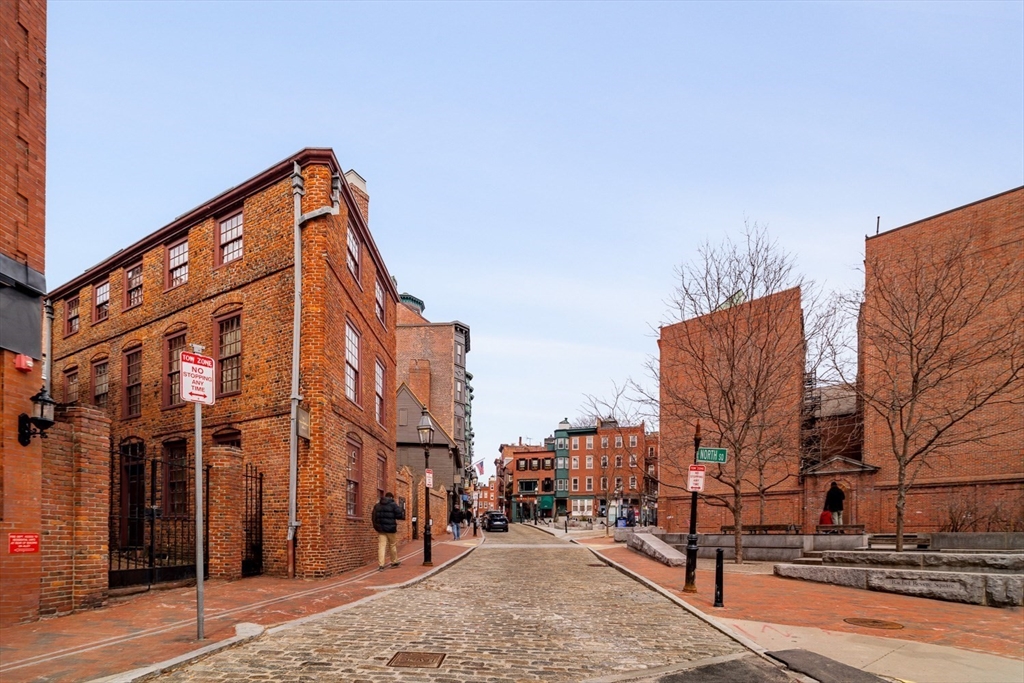 188 North Street, Unit 64 Boston, MA 02113 - Photo 24 of 27 a view of a street with a building in the background