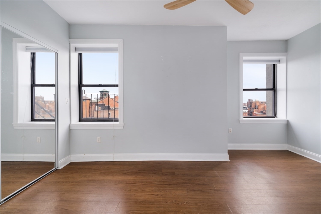 188 North Street, Unit 64 Boston, MA 02113 - Photo 10 of 27 a view of an empty room with wooden floor and a window
