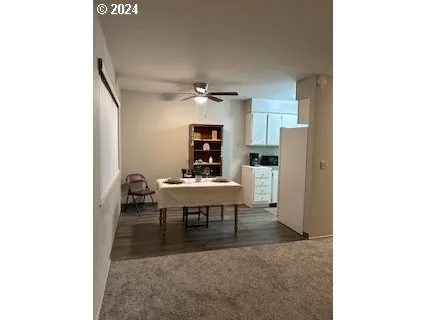 a view of a livingroom with furniture and window