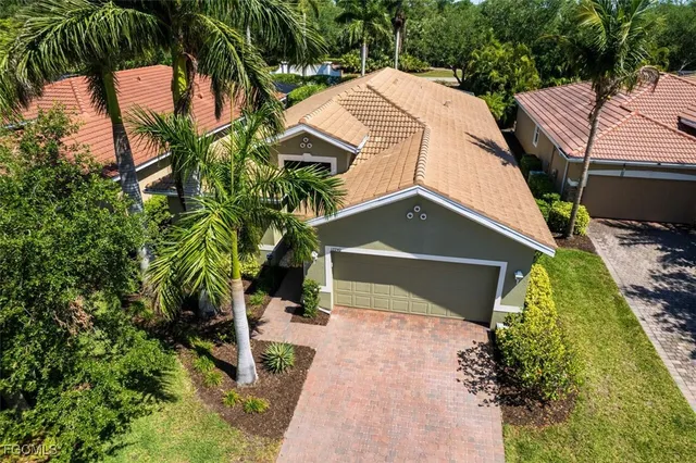 a aerial view of a house with a yard