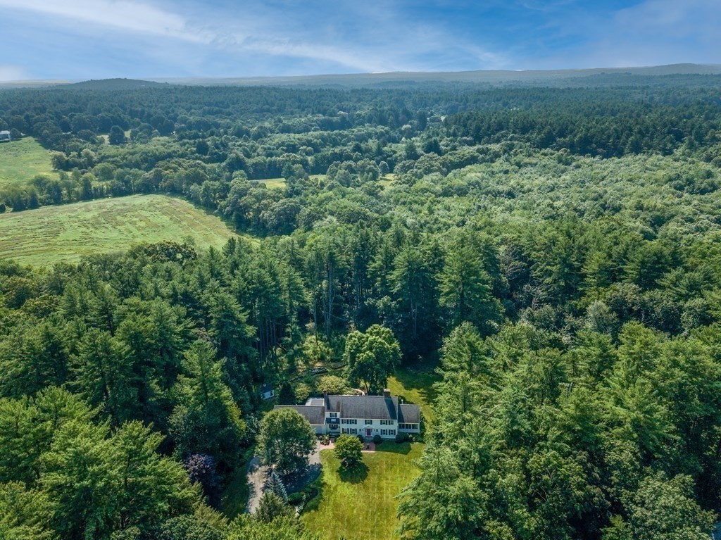 353 Lindsay Pond Road Concord, MA 01742 - Photo 4 of 42 an aerial view of residential houses with outdoor space and trees