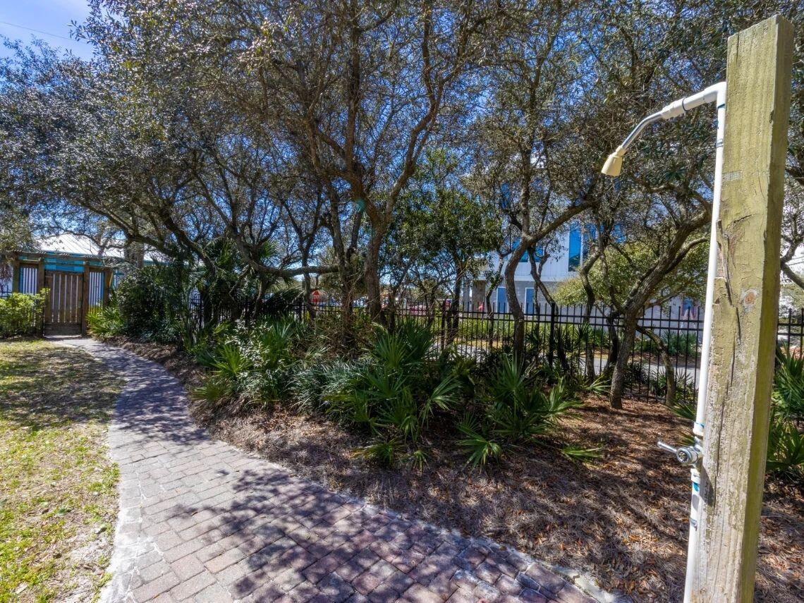 81 South Orange Street, Unit 102 Inlet Beach, FL 32461 - Photo 21 of 24 a backyard of a house with lots of green space