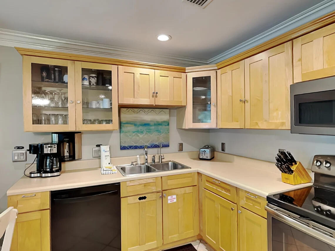 81 South Orange Street, Unit 102 Inlet Beach, FL 32461 - Photo 6 of 24 a kitchen with a sink stove top oven and cabinets