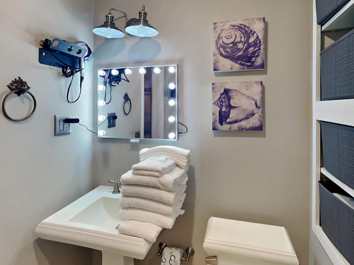 81 South Orange Street, Unit 102 Inlet Beach, FL 32461 - Photo 10 of 24 a bathroom with a sink mirror and toilet