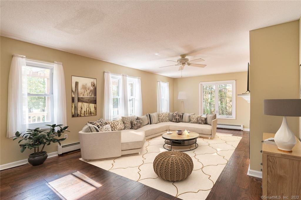 74-76 Towantic Hill Road Oxford, CT 06478 - Photo 3 of 38 Large living room Bathed in light (Virtually staged)