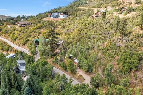 a view of house with a tree