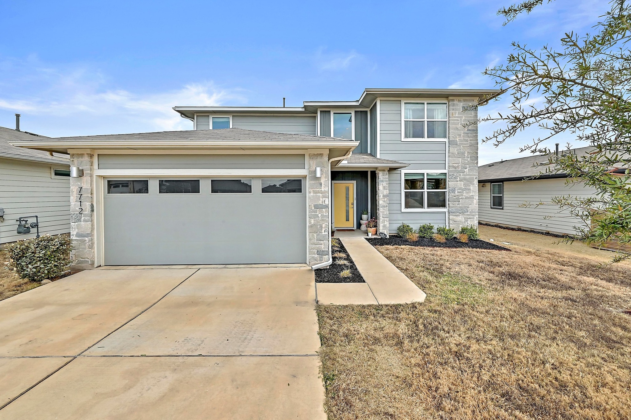 a front view of a house with a yard