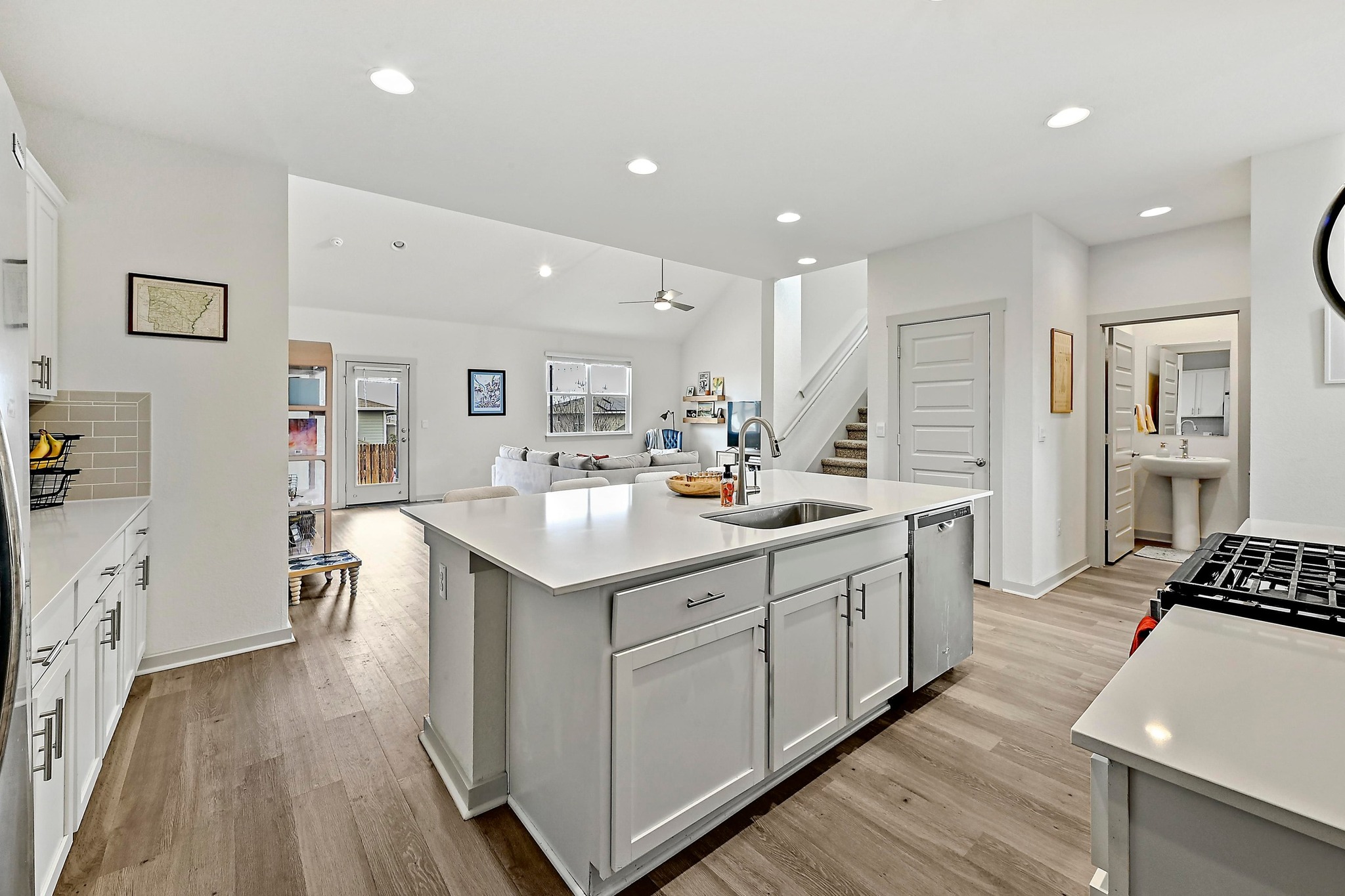 7712 Linnie Lane Austin, TX 78724 - Photo 13 of 37 a kitchen with counter top space sink and center island