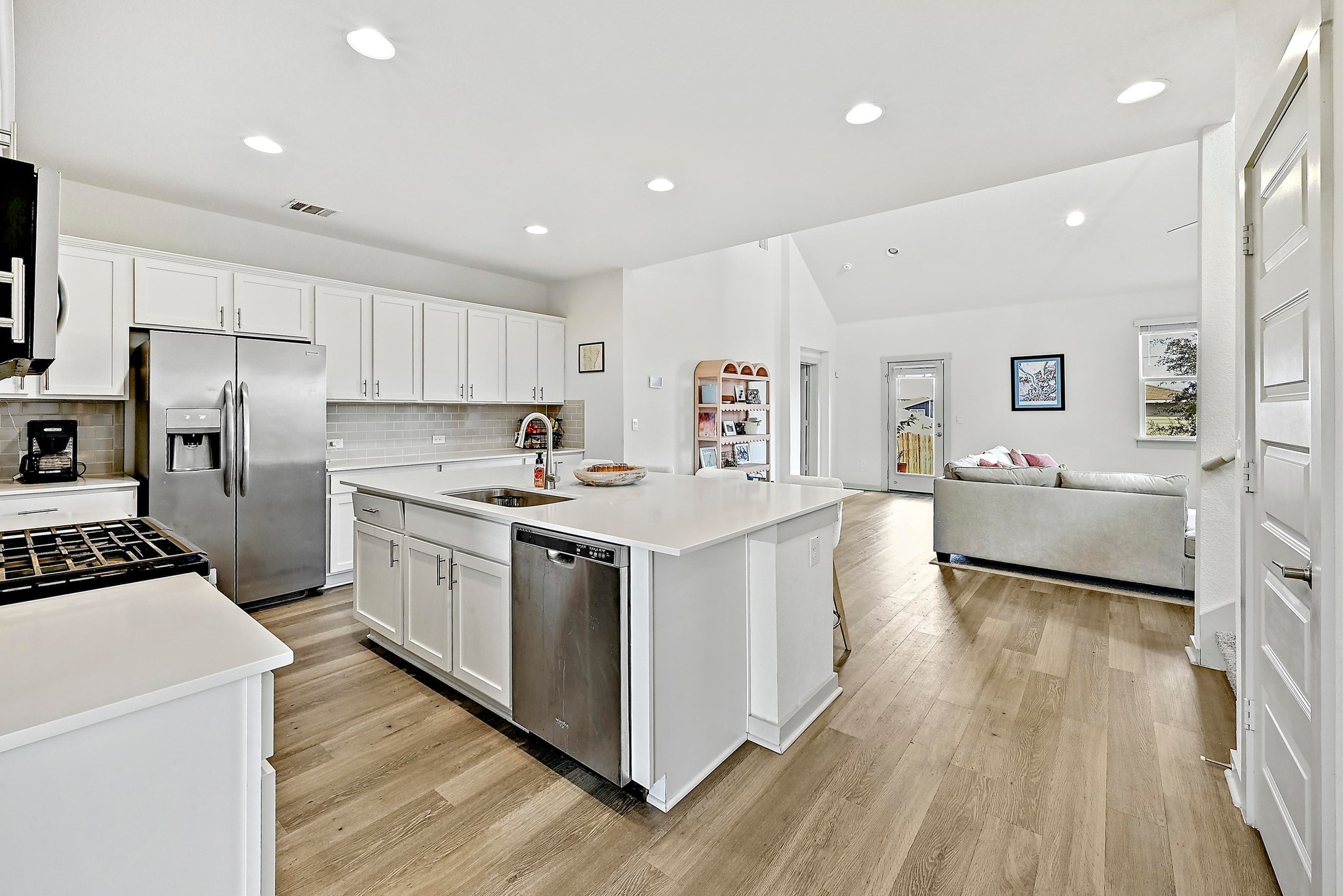 7712 Linnie Lane Austin, TX 78724 - Photo 14 of 37 a kitchen with white cabinets and stainless steel appliances