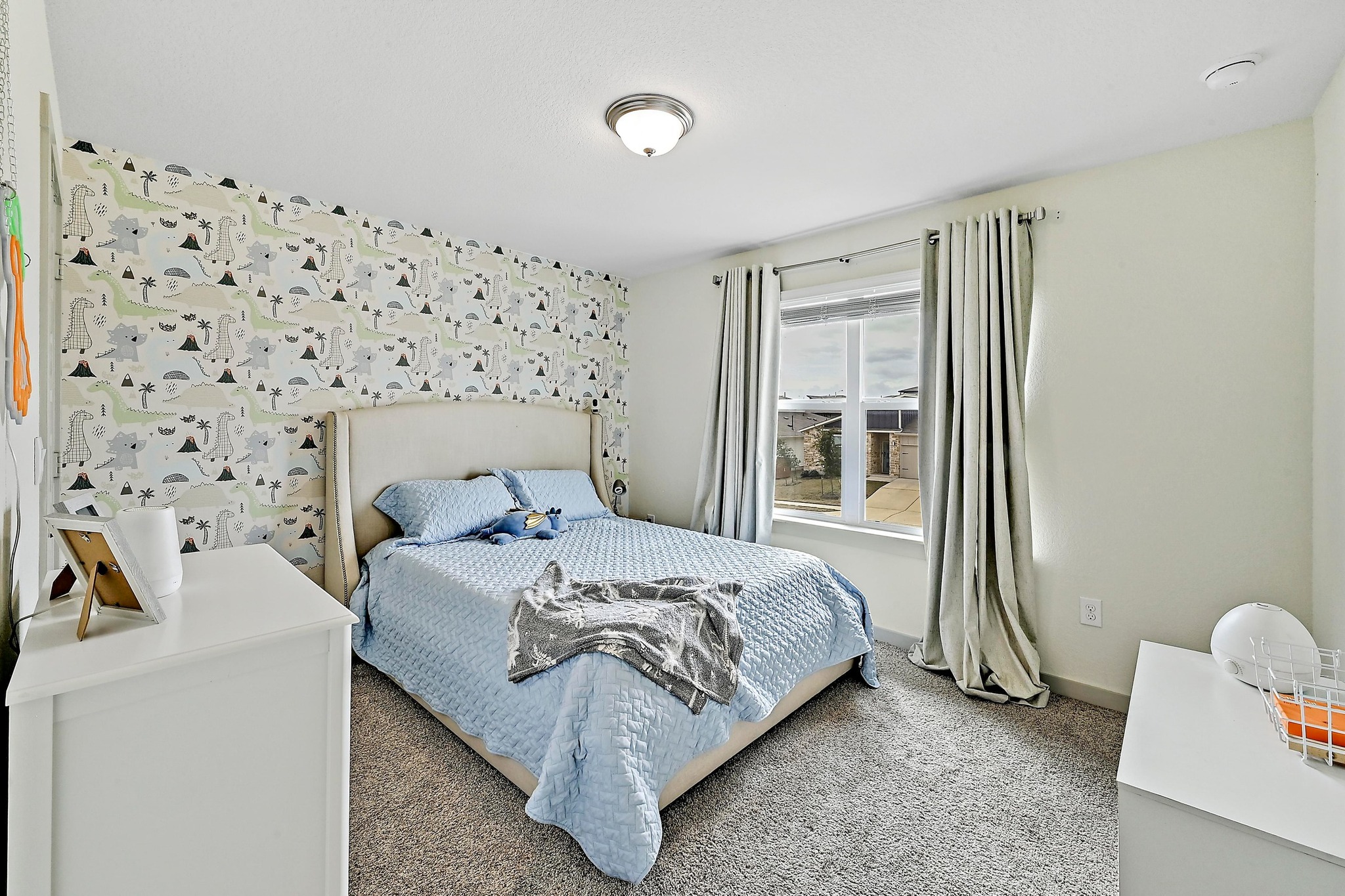 7712 Linnie Lane Austin, TX 78724 - Photo 25 of 37 a bedroom with a bed and a chair