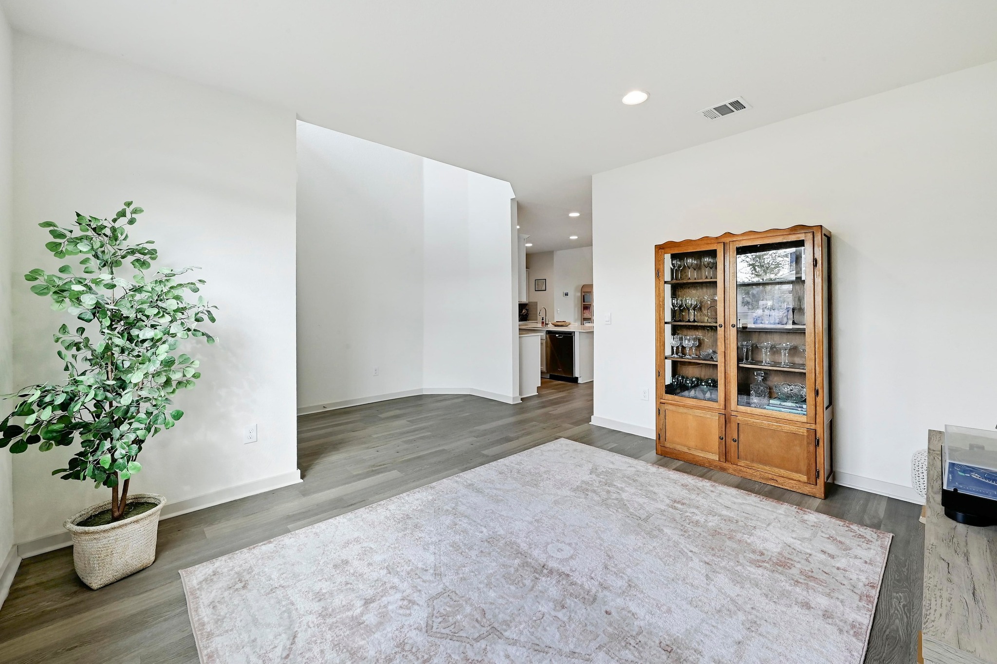 7712 Linnie Lane Austin, TX 78724 - Photo 6 of 37 a view of an empty room with a potted plant