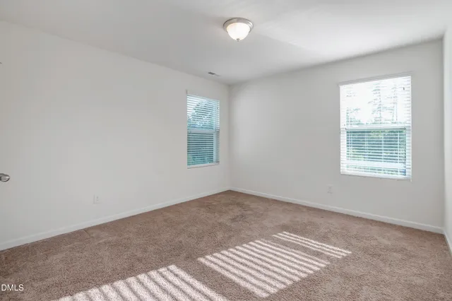 a view of a house with backyard