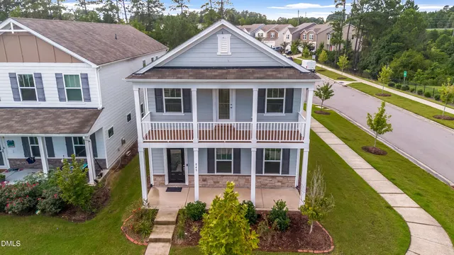 a aerial view of a house with a yard