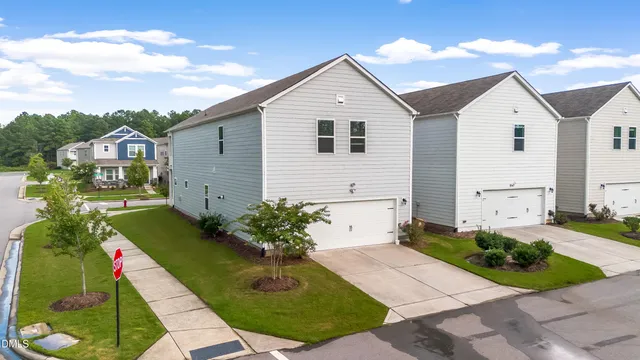 an aerial view of a residential houses with outdoor space