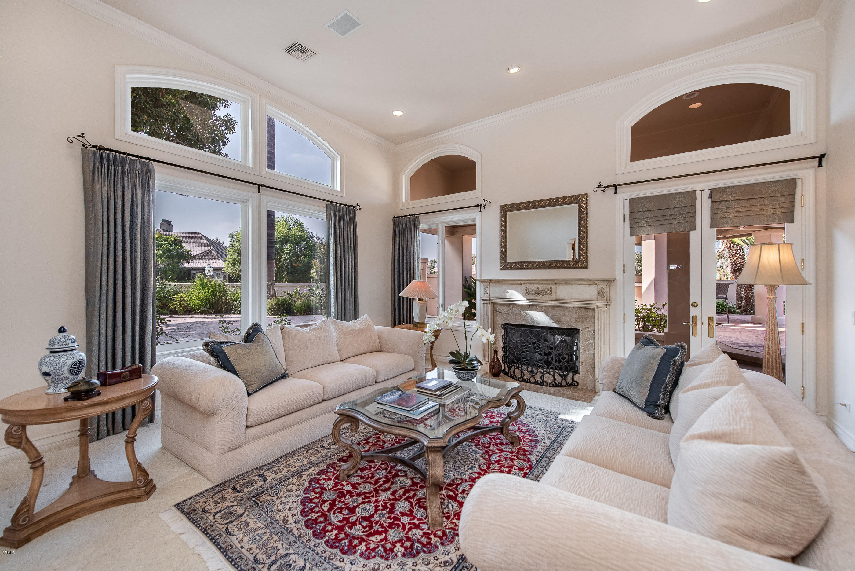 657 Corte Corrida Camarillo, CA 93010 - Photo 18 of 74 a living room with furniture a fireplace and a large window