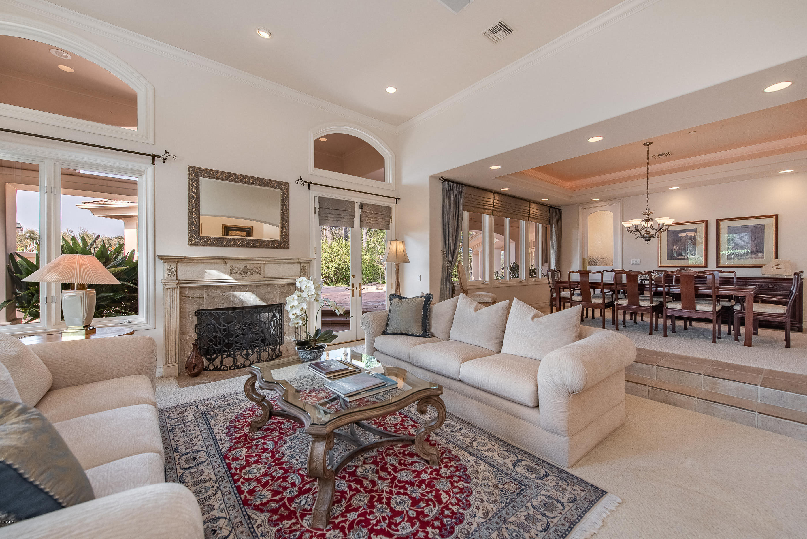 657 Corte Corrida Camarillo, CA 93010 - Photo 19 of 74 a living room with furniture a fireplace and a table