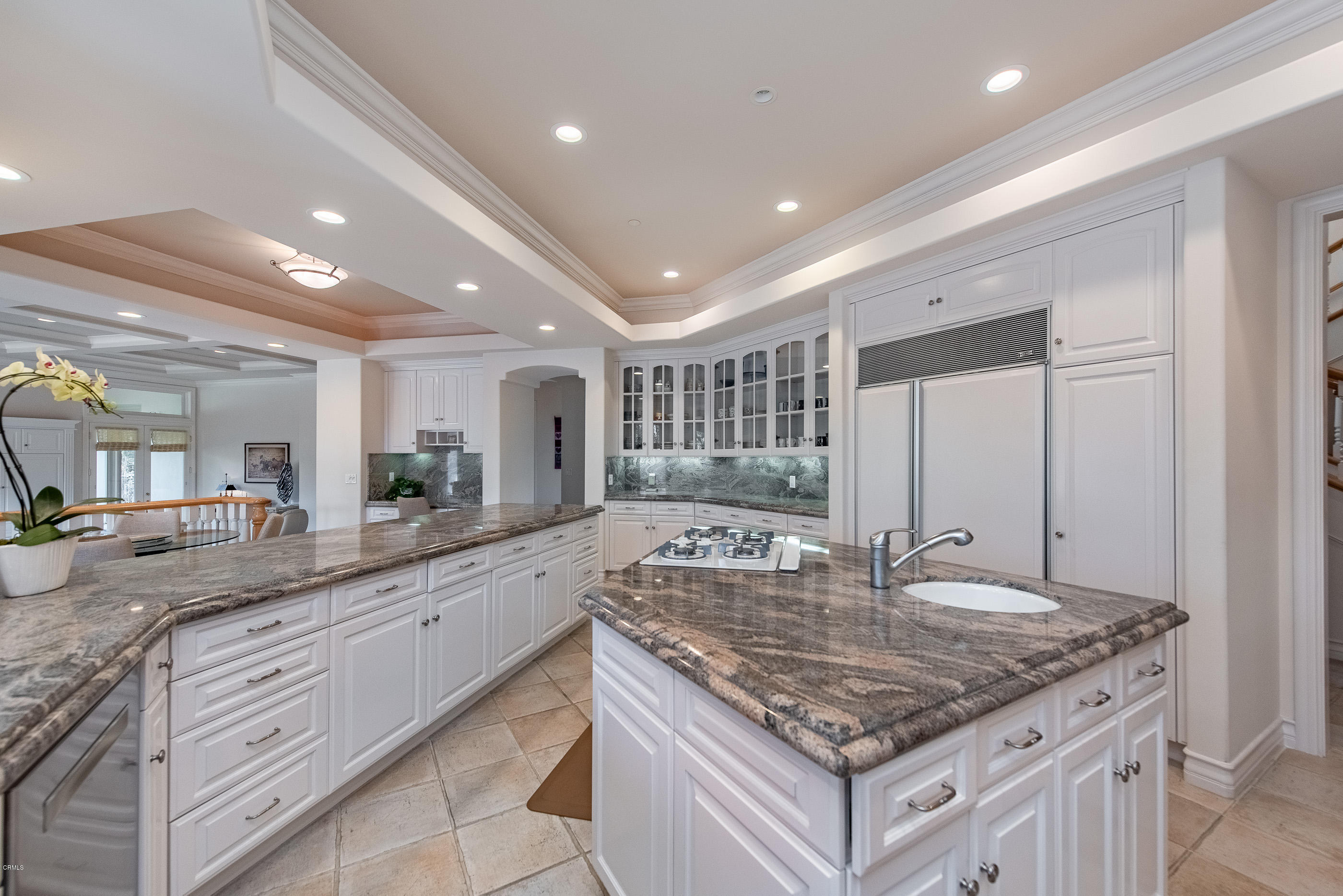 657 Corte Corrida Camarillo, CA 93010 - Photo 25 of 74 a kitchen with kitchen island granite countertop a large counter top and stainless steel appliances