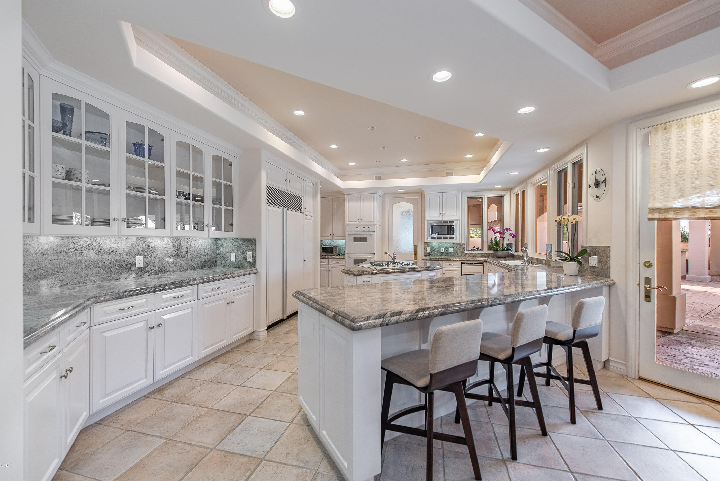 657 Corte Corrida Camarillo, CA 93010 - Photo 26 of 74 a kitchen with stainless steel appliances granite countertop a stove a sink and a refrigerator