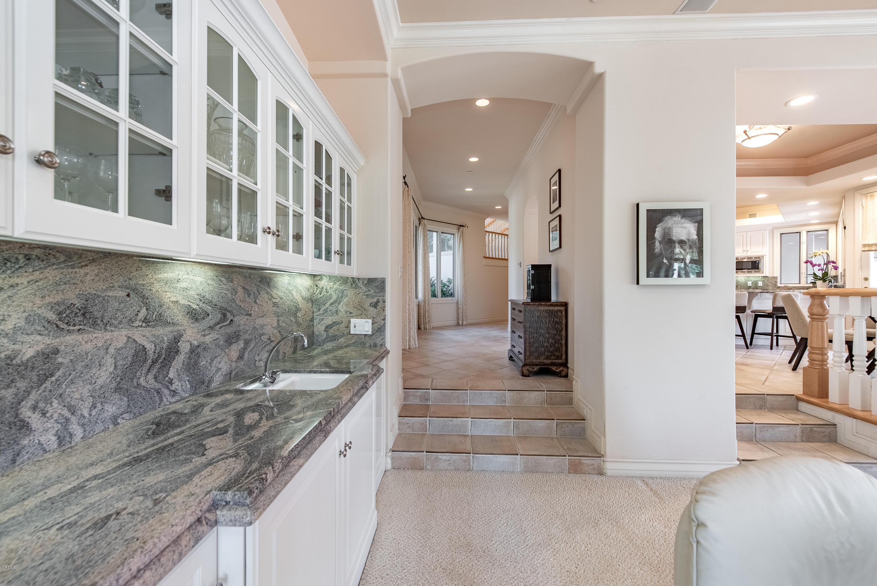 657 Corte Corrida Camarillo, CA 93010 - Photo 30 of 74 a bathroom with a granite countertop sink and a refrigerator
