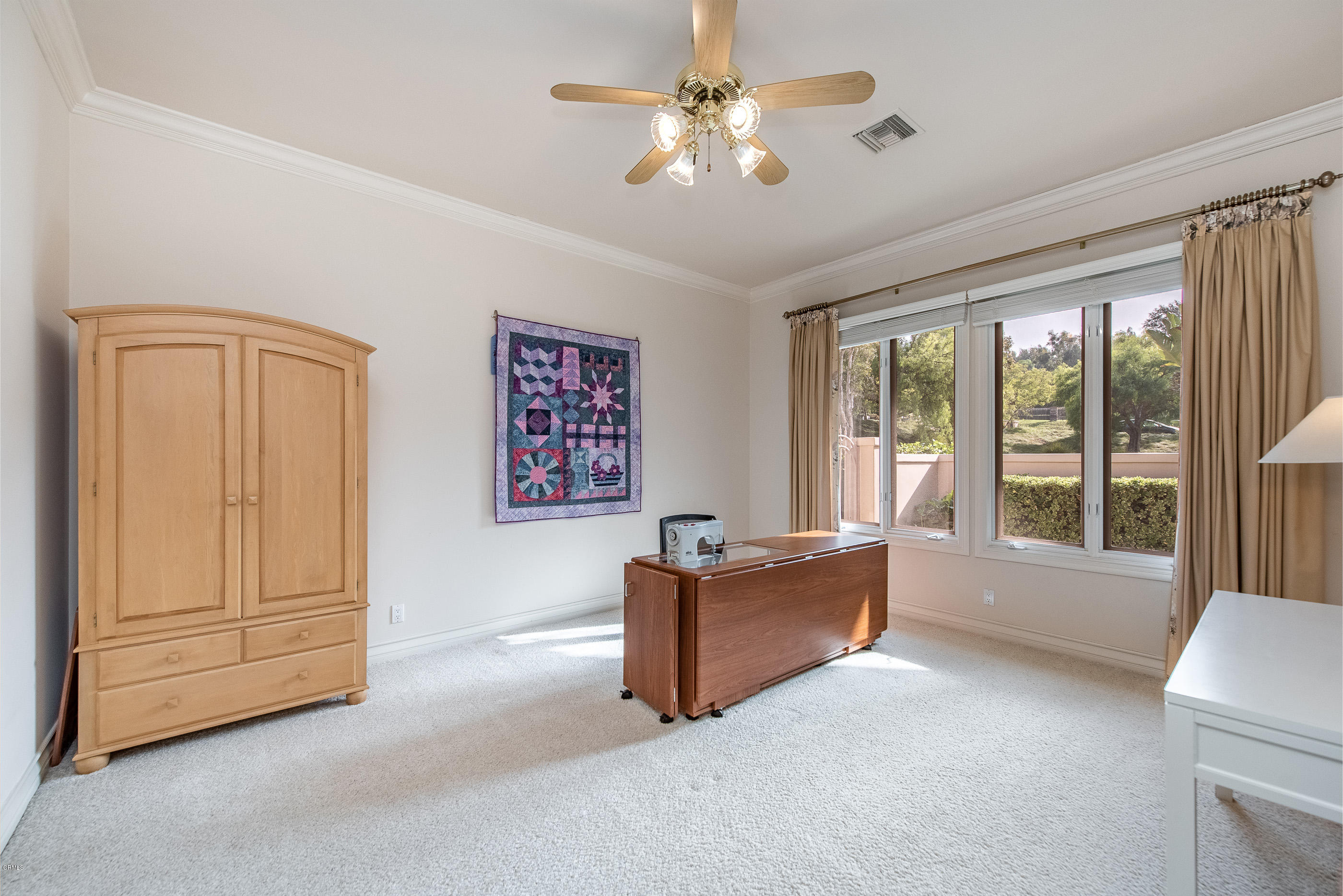 657 Corte Corrida Camarillo, CA 93010 - Photo 34 of 74 a living room with furniture and a ceiling fan