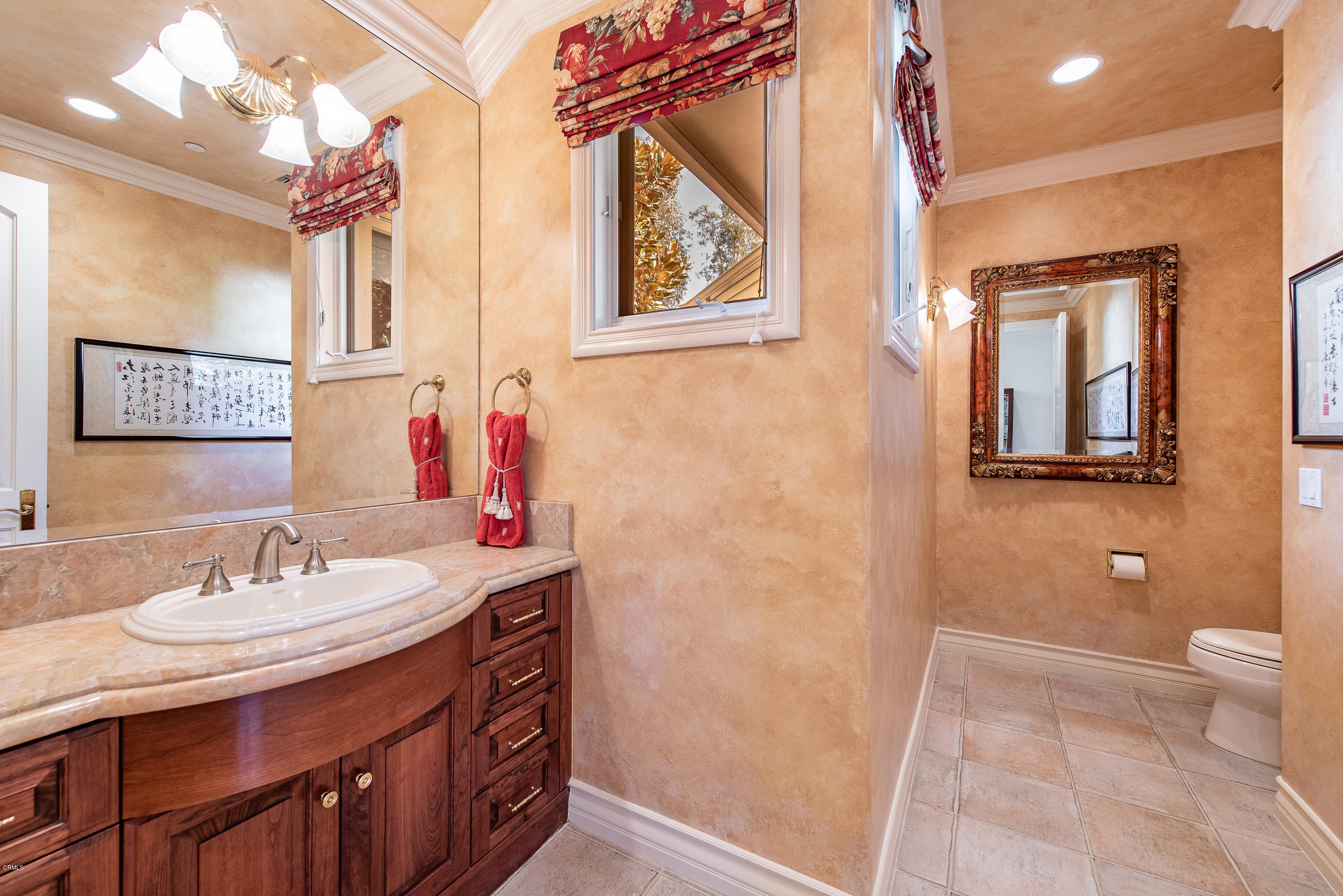 657 Corte Corrida Camarillo, CA 93010 - Photo 36 of 74 a bathroom with a sink and a mirror