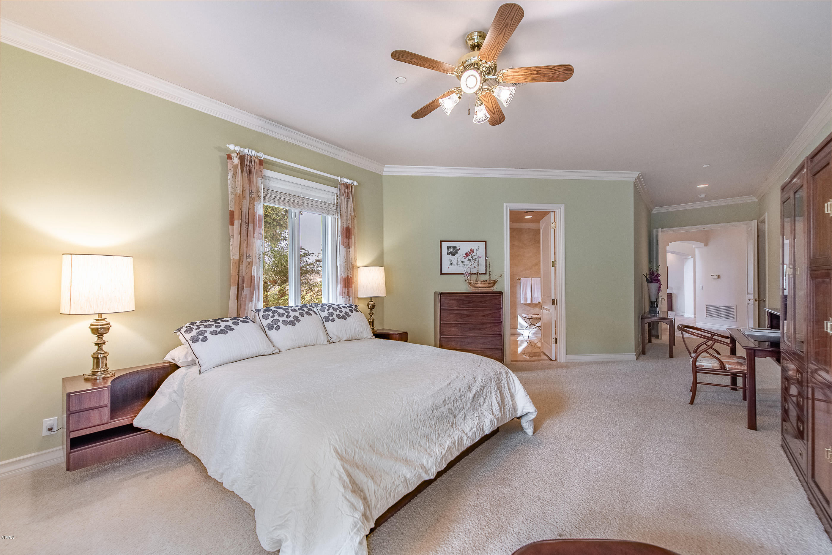 657 Corte Corrida Camarillo, CA 93010 - Photo 39 of 74 a bedroom with a bed and a chandelier