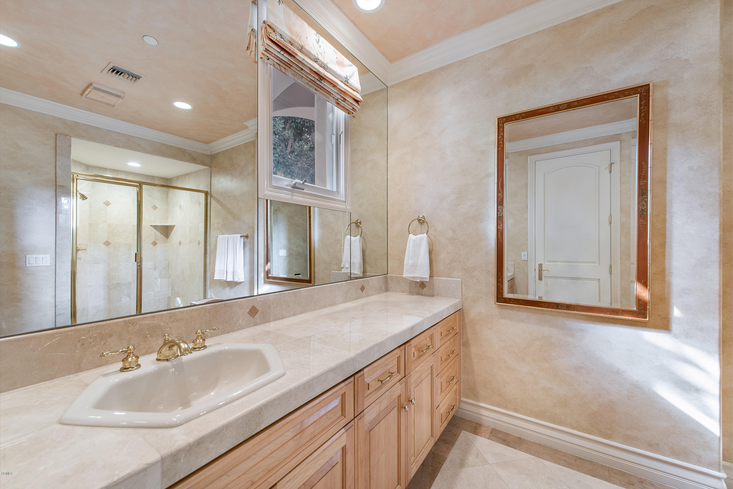 657 Corte Corrida Camarillo, CA 93010 - Photo 40 of 74 a bathroom with a sink and a mirror