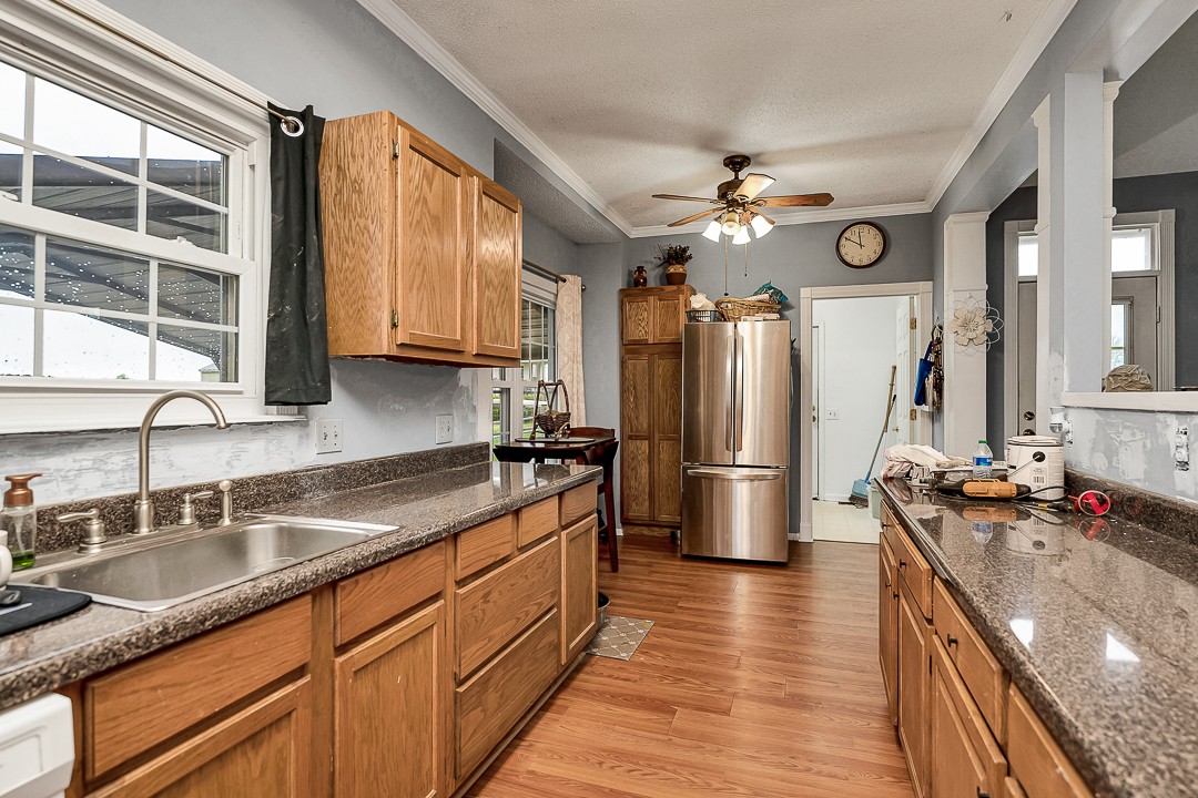 624 Faith-Rae Boulevard Morrison, TN 37357 - Photo 11 of 38 a kitchen with stainless steel appliances granite countertop a sink stove and refrigerator