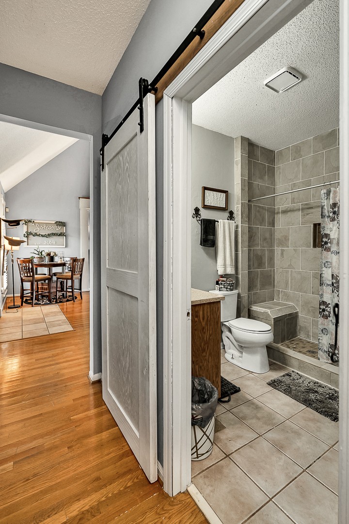 624 Faith-Rae Boulevard Morrison, TN 37357 - Photo 13 of 38 a bathroom with a toilet a sink and a shower