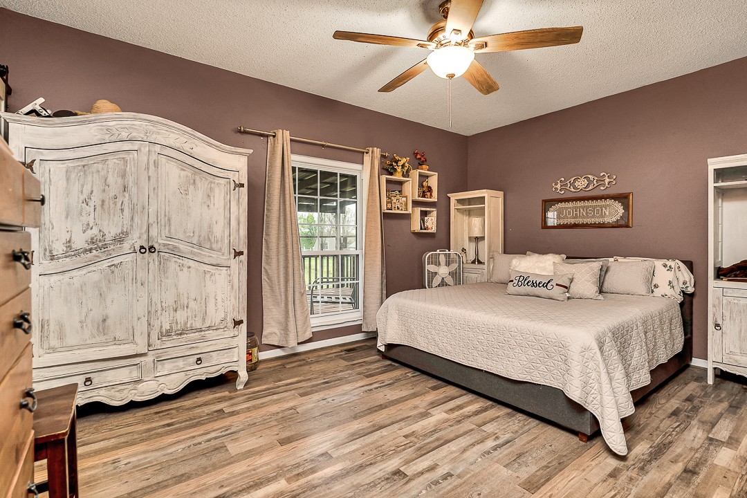 624 Faith-Rae Boulevard Morrison, TN 37357 - Photo 18 of 38 a spacious bedroom with a bed and a chandelier
