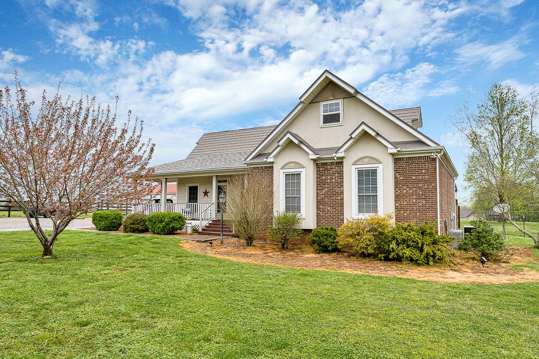 624 Faith-Rae Boulevard Morrison, TN 37357 - Photo 2 of 38 a front view of a house with garden