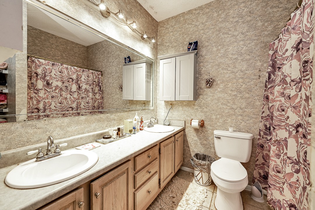 624 Faith-Rae Boulevard Morrison, TN 37357 - Photo 21 of 38 a bathroom with a double vanity sink toilet and a mirror