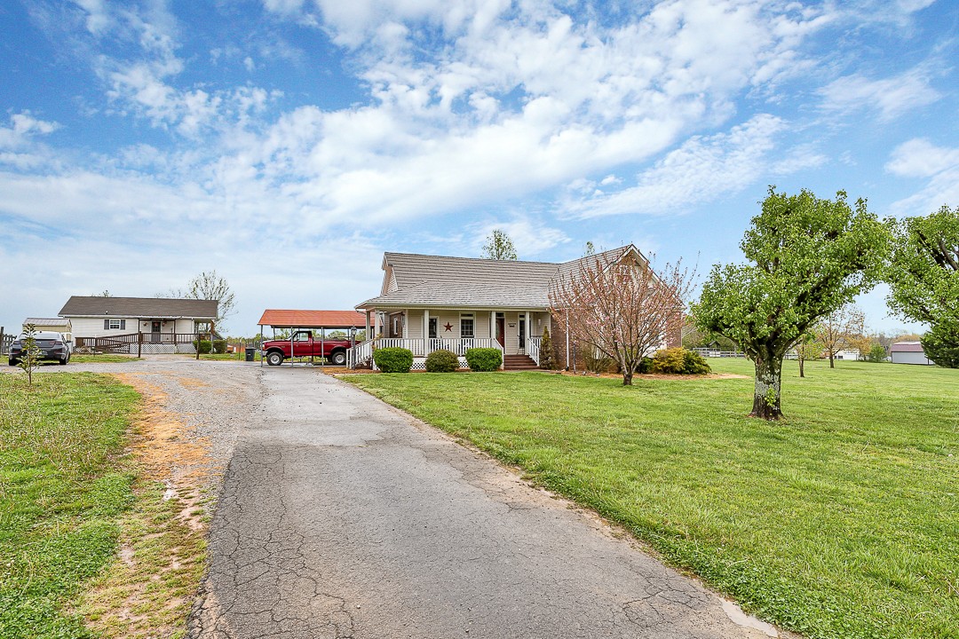 624 Faith-Rae Boulevard Morrison, TN 37357 - Photo 26 of 38 a view of a big house with a garden and trees