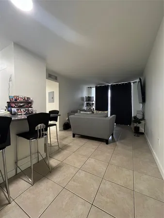 a kitchen with a dining table chairs and a counter top space