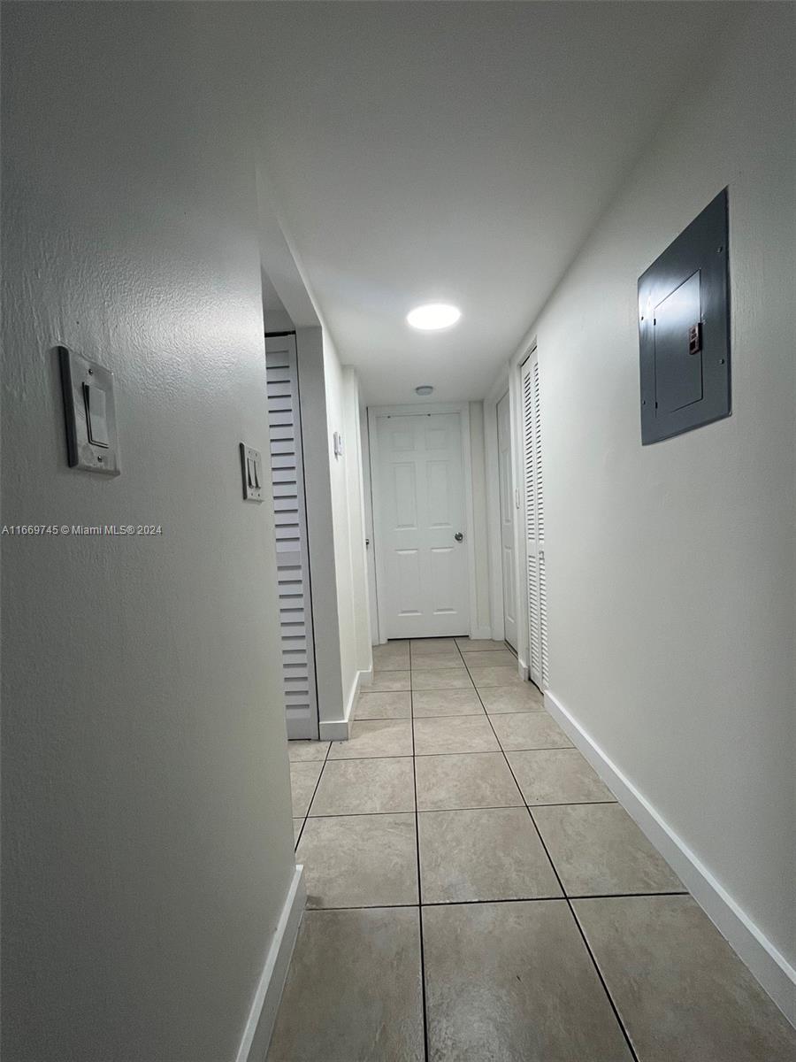 8075 Northwest 7th Street, Unit 109 Miami, FL 33126 - Photo 7 of 14 a view of an empty room