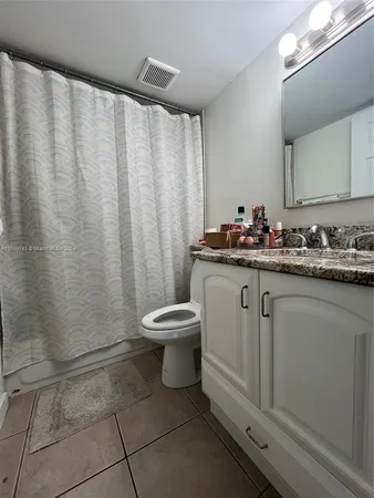 a room with bed and window