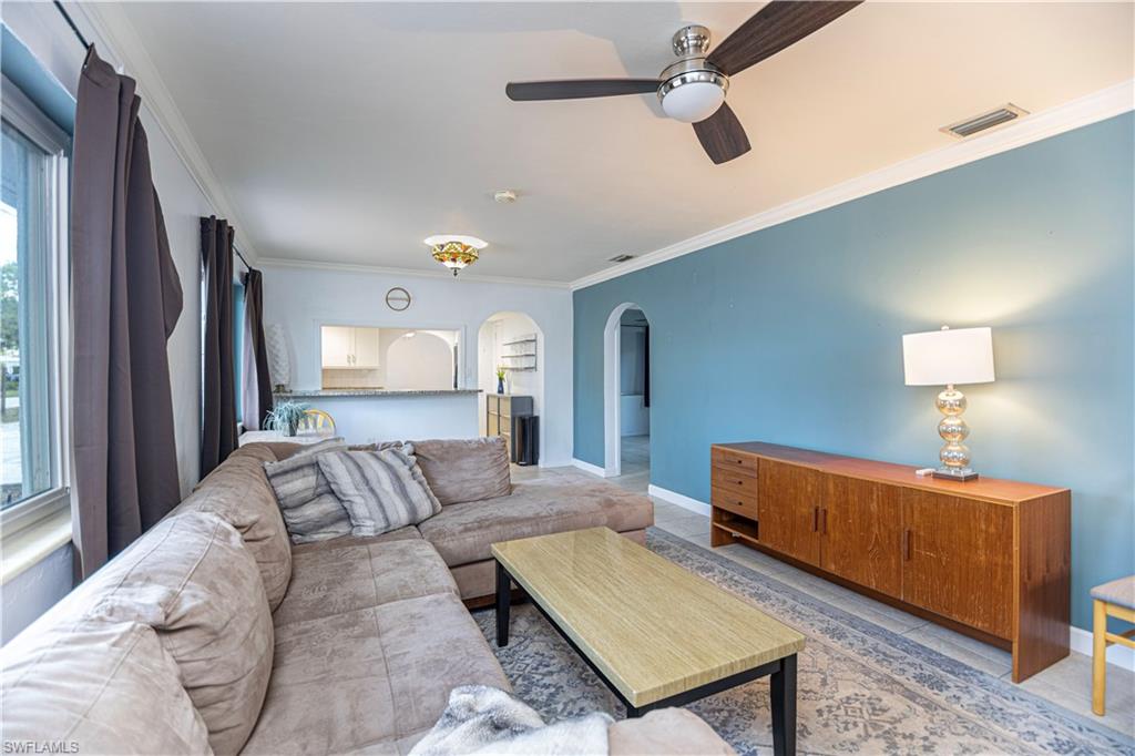 1003 Trail Terrace Drive Naples, FL 34103 - Photo 17 of 23 a bedroom with furniture and a lamp