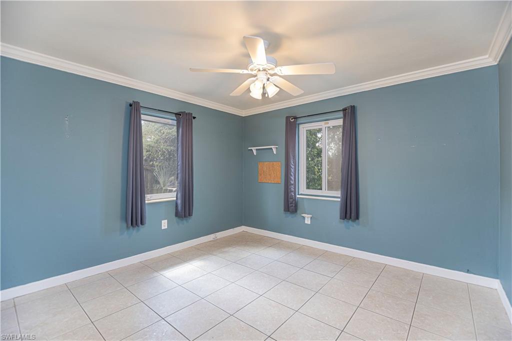 1003 Trail Terrace Drive Naples, FL 34103 - Photo 21 of 23 a view of an empty room with window