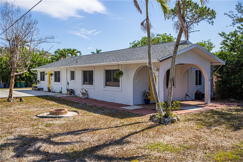 1003 Trail Terrace Drive Naples, FL 34103 - Photo 7 of 23 a view of a house with snow on the road
