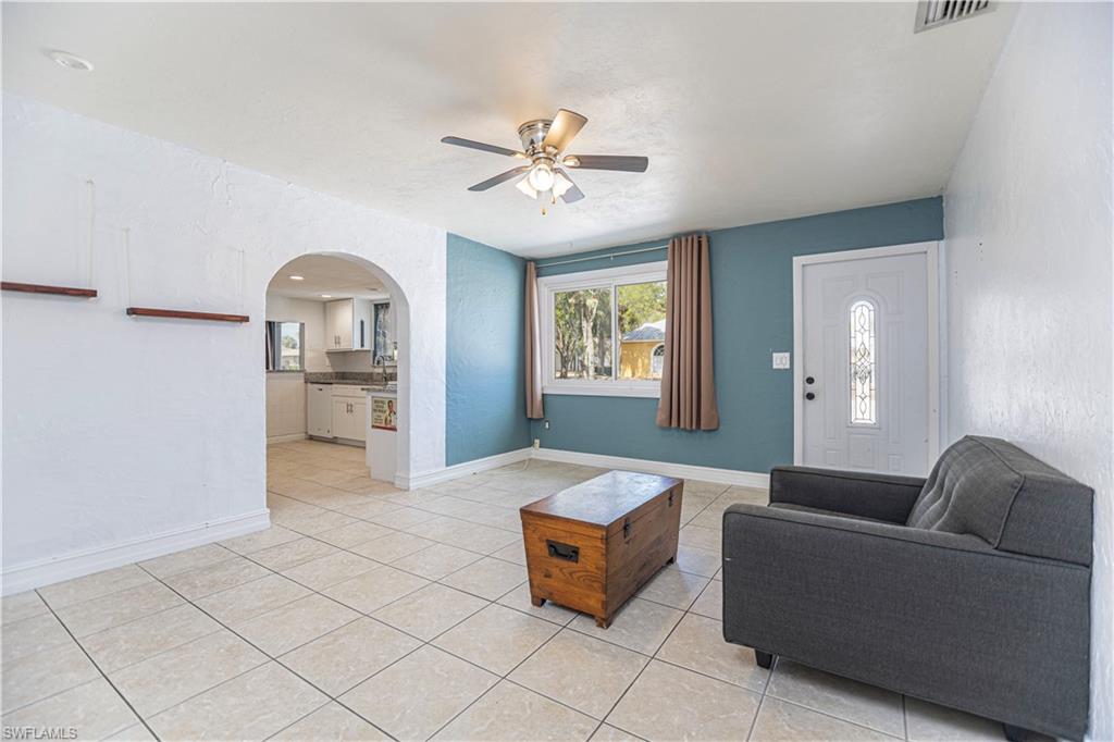 1003 Trail Terrace Drive Naples, FL 34103 - Photo 8 of 23 a living room with furniture and a wooden floor