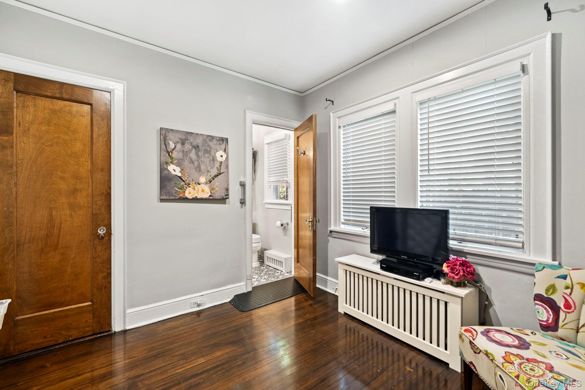 44 Fenimore Road New Rochelle, NY 10804 - Photo 14 of 46 a view of a livingroom with furniture and a flat screen tv