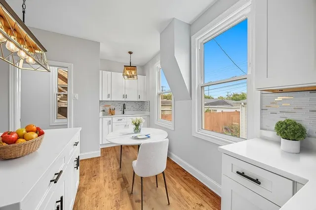 a kitchen with stainless steel appliances a sink a stove and a window
