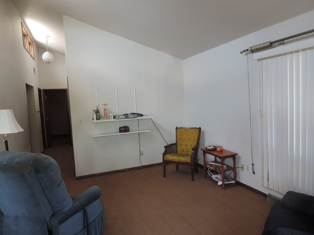 106 Thornton Street Lockport, IL 60441 - Photo 2 of 9 a view of a livingroom with furniture and a window