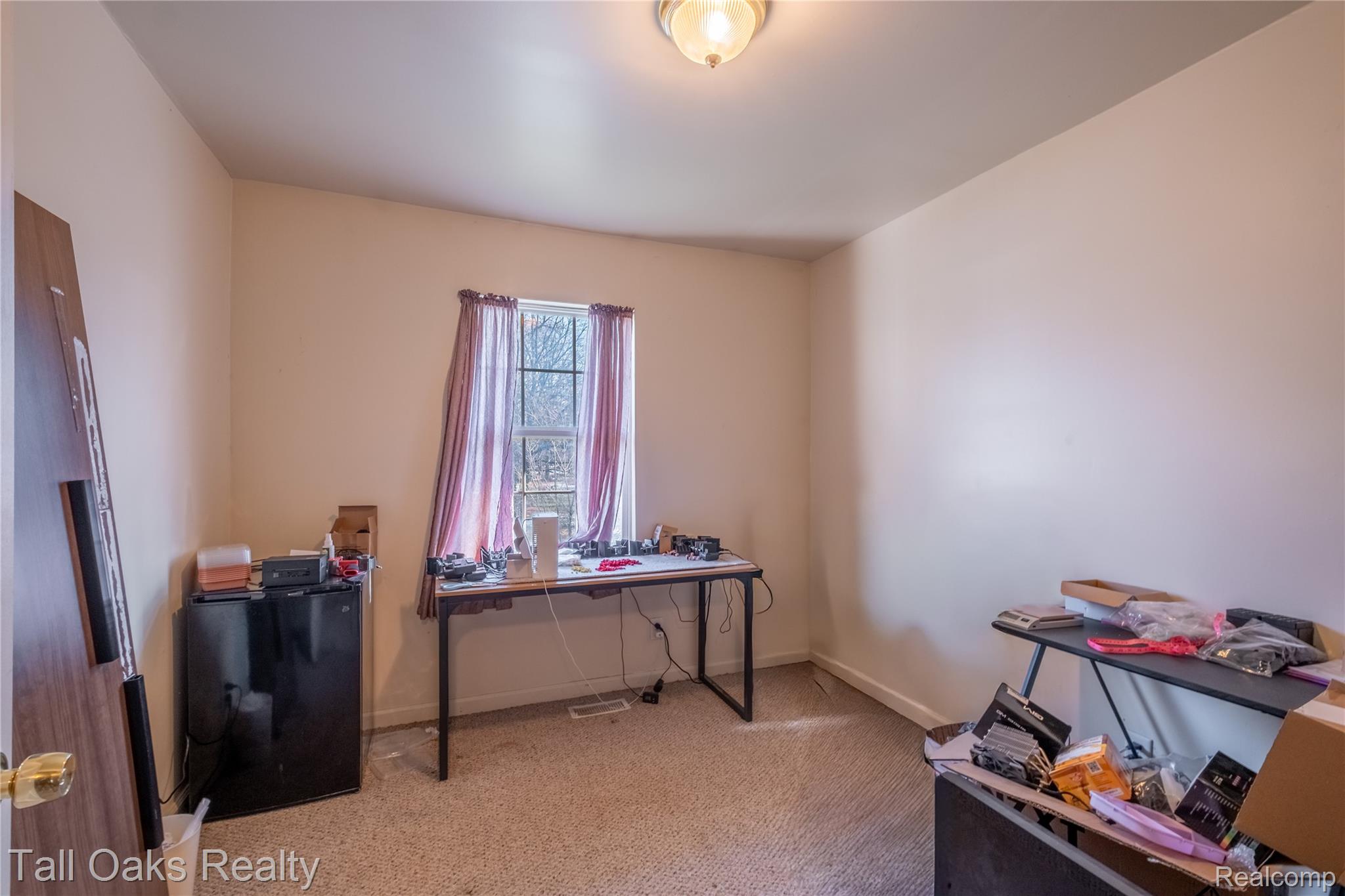 6054 East Pierson Road Flint, MI 48506 - Photo 32 of 38 Office space featuring light carpet and baseboards