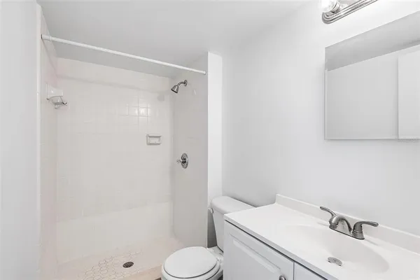 a view of a bathroom from a hallway