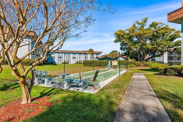 a view of a backyard with swimming pool