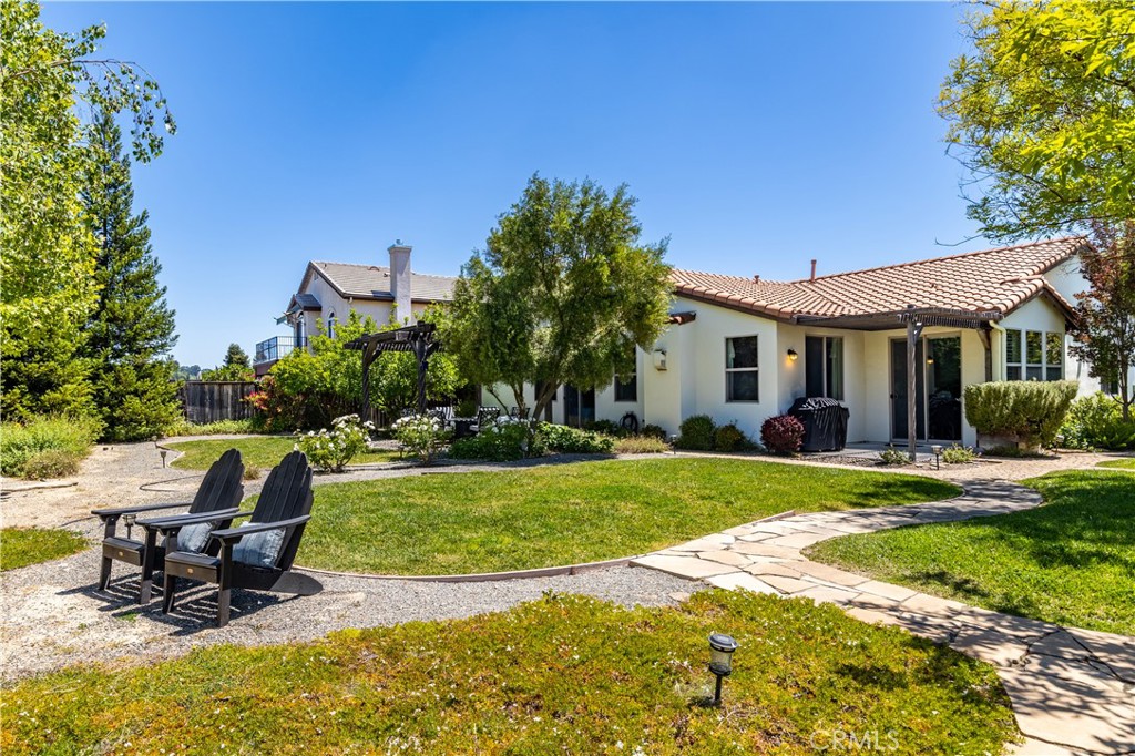 669 Red Cloud Road Paso Robles, CA 93446 - Photo 4 of 61 a view of a house with backyard and sitting area